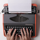 hands on a typewriter